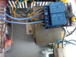 SRD-05VDC-SL-C relay module mounted above a transformer with connected wires
