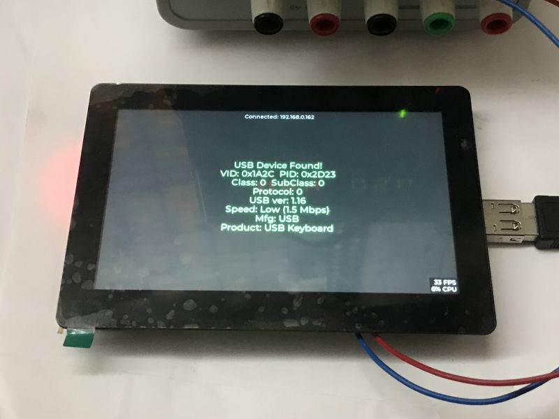 Touchscreen showing “USB Device Found!” and “Product: USB Keyboard,” with a USB-A plug connected on the right