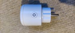 Smart Plug with Power Button White smart plug with a power button on the housing