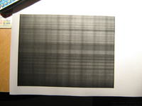 Pionowe blade pasy po napełnieniu czarnego tonera CLP-315