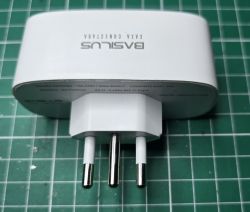 BASILUS Smart Plug BASILUS smart plug on a green background.