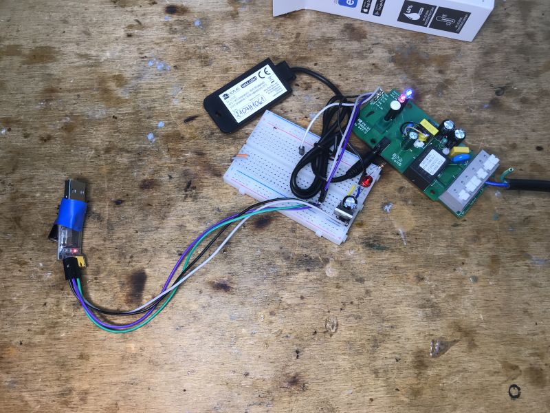 Disassembled Electrical Module with Sensor and Wires The photo shows a disassembled electrical module with a breadboard and sensor connected by wires.