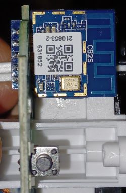 Blue CB2S WiFi Module in Smart Plug Close-up of the blue CB2S WiFi module in a smart plug.