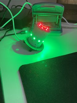 Device with LEDs glowing red and green.