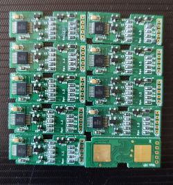 Electronic modules with green PCBs and unidentified integrated circuit.