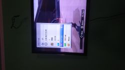 TV screen showing video playback settings menu with file info overlay on the left