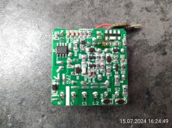 Curtain Module PCB Close-up of a green PCB with various electronic components and markings.