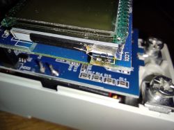 Close-up of a printed circuit board with an attached LCD display.
