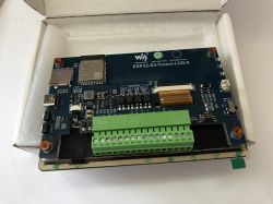 Waveshare ESP32-S3-Touch-LCD-5 Board in Packaging Waveshare ESP32-S3-Touch-LCD-5 development board with connectors, ESP32 module, and screw terminals, placed in foam packaging.
