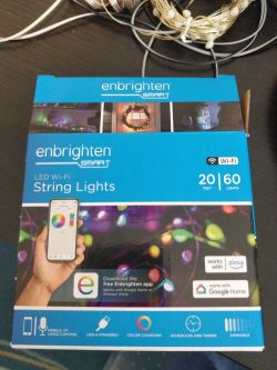 Enbrighten Smart LED Wi-Fi String Lights Packaging Box of Enbrighten Smart LED Wi-Fi String Lights on a table.