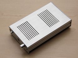 Headphone amplifier enclosure with metallic finish.