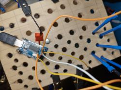 Test board with wires connected to an electronic module.