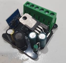 Electronic Module with CB2S Component Photo of an electronic module with components such as capacitors, a green terminal block, and a blue module labeled CB2S.