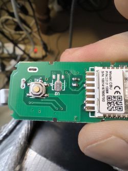 Circuit Board with Button and CBU Module Circuit board with a button and a module labeled Model: CBU.