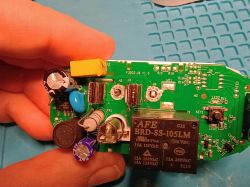 Disassembly of the Aqia Model F3202-US Smart Wi-Fi Outlet Circuit board of a smart Wi-Fi outlet with electronic components