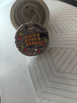 Electronic board with visible LEDs and markings.
