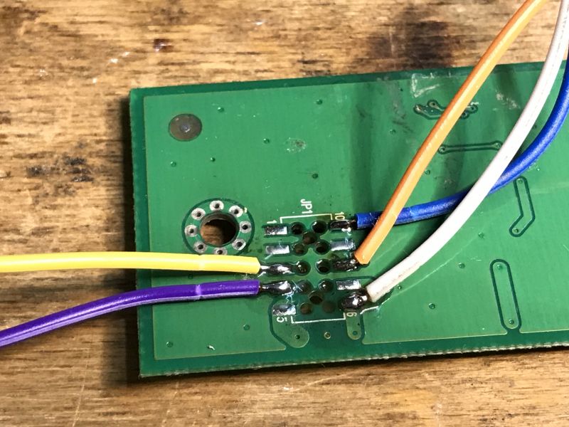 Printed Circuit Board with Soldered Wires Close-up of a printed circuit board with soldered colored wires