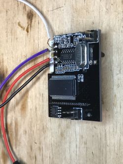 Photo of an electronic module with several connected wires.