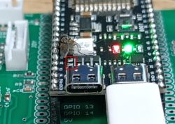 ESP module with USB connection and highlighted jumper on the PCB