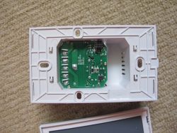 Interior of Cozylife DS-1211AN Switch Interior of a plastic casing of a 3-gang touch wall switch Cozylife DS-1211AN with a visible green circuit board.
