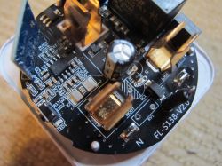 Inside a Smart Plug with Energy Metering Close-up of a circuit board inside a smart plug with energy metering.
