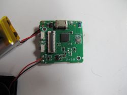 Electronic PCB with Components PCB board with connected wires and visible micro USB port.