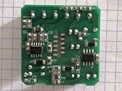 Close-up of a PCB with two ICs and various surface-mounted components