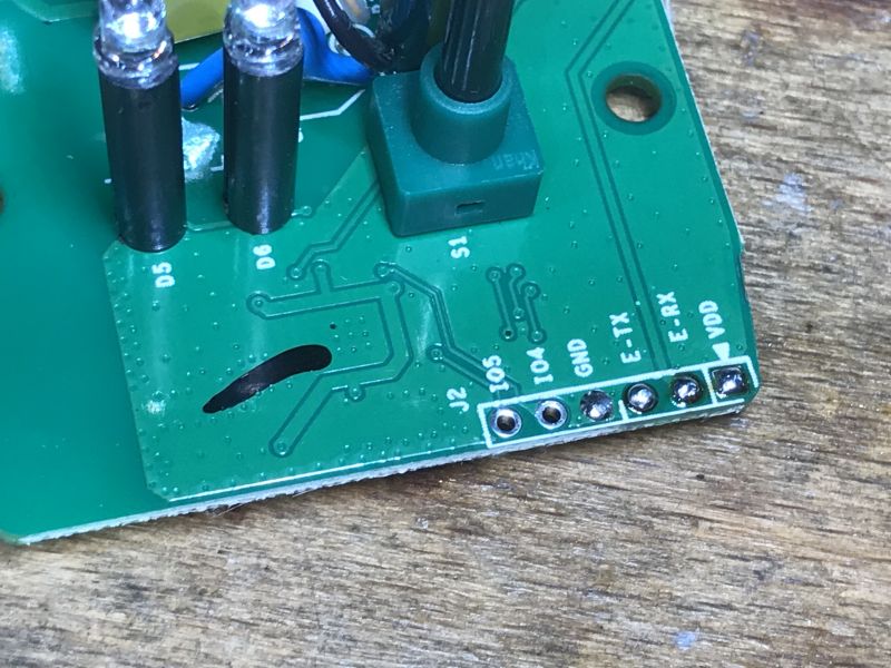 Inside WS-04H1 with Programming Pads Close-up of WS-04H1 circuit board with visible programming pads and components.