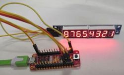 7-Segment Display Controlled by Microcontroller Microcontroller chip connected to a 7-segment display showing numbers from 0 to 8.