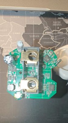 Dismantled Tuya Smart Plug Board Close-up of the dismantled electronic board of a Tuya smart plug with visible components.