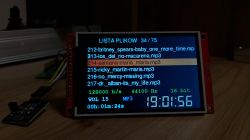 Small screen displays MP3 file list with playback details of selected file.