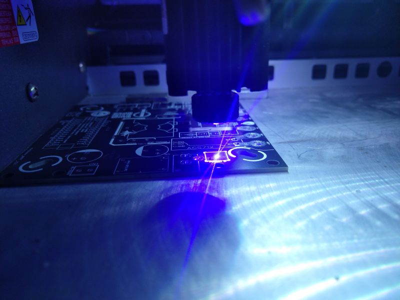 Testing circuit paths on a PCB using a laser.
