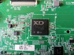 Zbliżenie na płytę główną EAX69105803 z układem LGE9321-AB1 i komponentami SMD