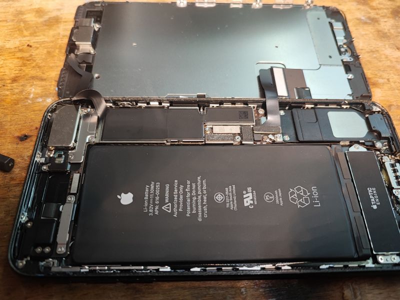 Inside of an Open iPhone with Battery Open iPhone showing internal components, including the battery.