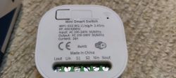 Mini Smart Switch Label Close-up of the label on a mini smart switch detailing technical specifications.