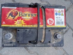 Old car battery with Banner Power Bull branding.