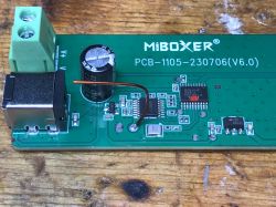Inside MiBoxer LED Controller without WiFi Close-up of the interior of a MiBoxer LED controller without WiFi showcasing electronics.
