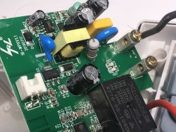 The inside of a circuit board with electronic components and connection terminals of the ATLO-S1IP5-TUYA socket.