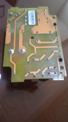 Image of the underside of a printed circuit board with visible copper traces.