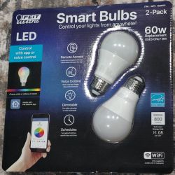 Feit Electric LED Smart Bulbs Packaging Packaging of two Feit Electric smart bulbs with remote control features.