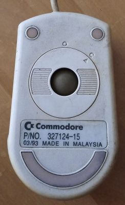 Old Commodore computer mouse from 1993, viewed from the bottom.