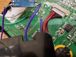 Close-up of a PCB with soldered wires, connector, and electronic components