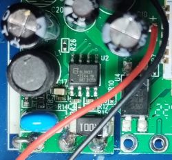 Close-up of a circuit board with BL0937 integrated circuit and attached wires.