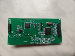 Printed circuit board with integrated circuits and connectors on a white background.
