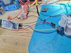 Testing Smart Plug with Electronic Board Electronic board with connected wires testing a smart plug.
