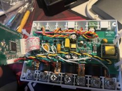 Interior of an electronic device with a visible circuit board and components.