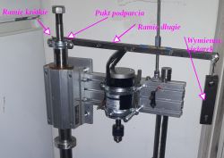 Counterweight mechanism with a drill and technical annotations.