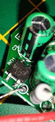 Close-up of a PCB section with visible capacitors and an MB10F bridge rectifier.