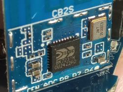 Close-up of a BK7231M chip on a circuit board.