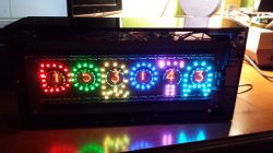 Nixie Tube Clock with LED Backlighting Handcrafted nixie tube clock with colorful LED backlighting.